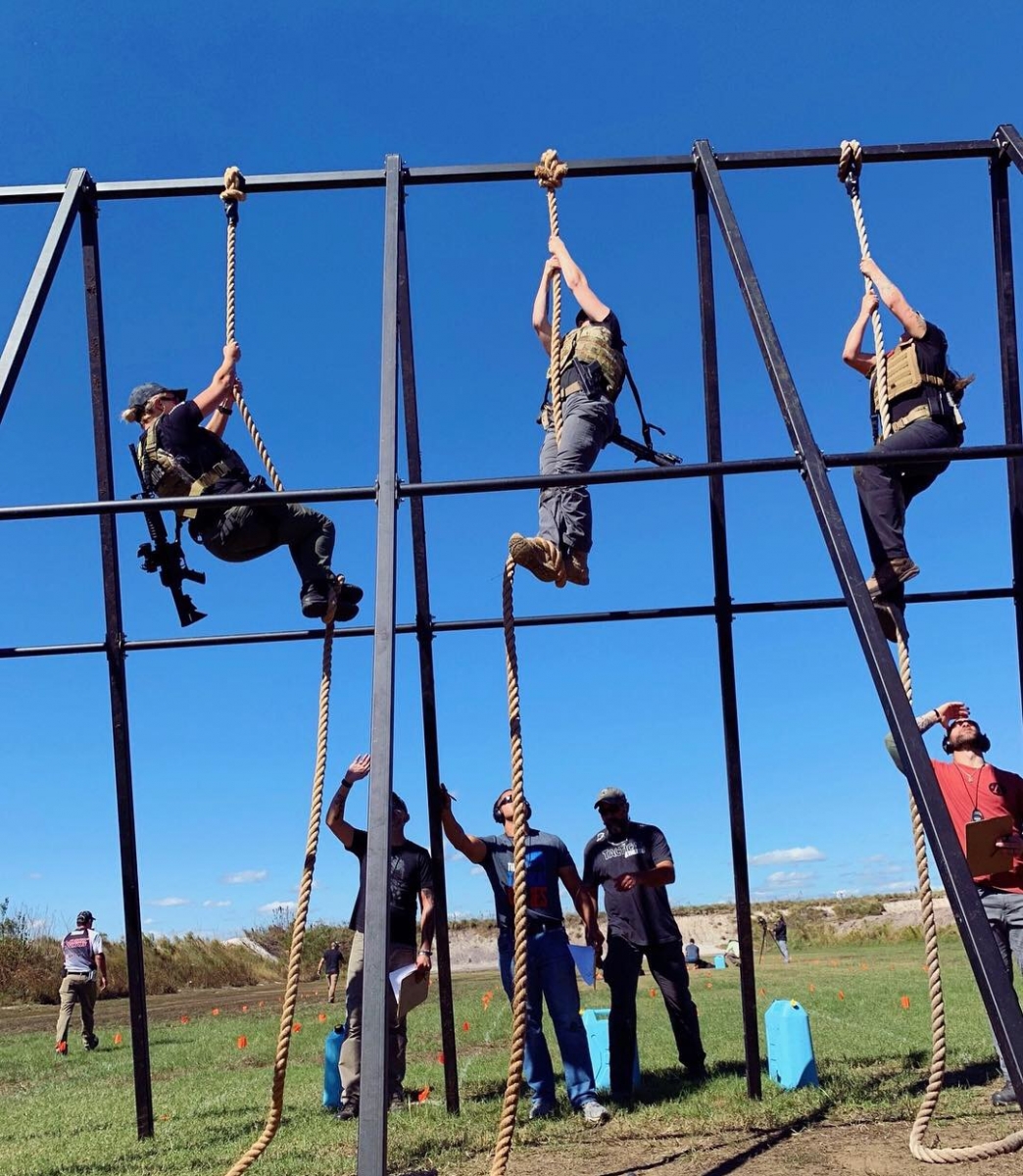 Two Female Mobile Police Officers Compete In The Tactical Games